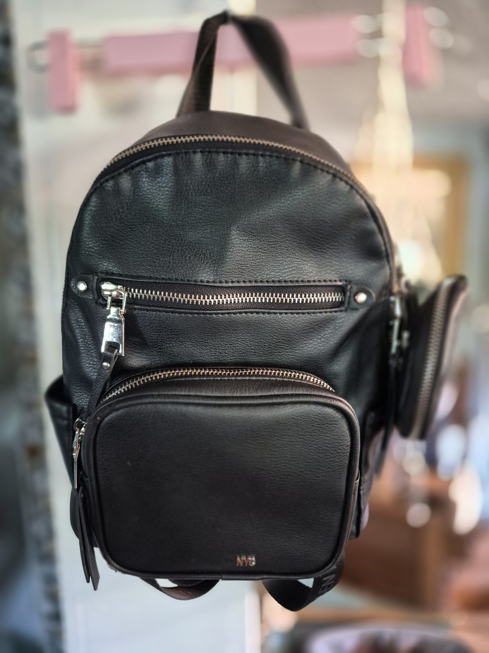 black Madden NYC mini backpack featuring a detachable pouch